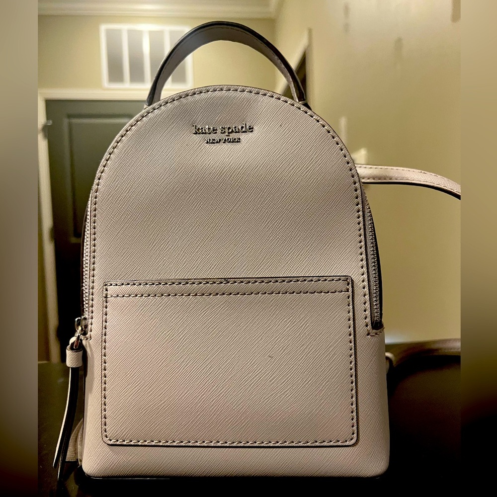 Kate Spade grey small backpack. Barely used. Like new.